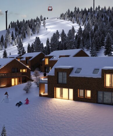 Snowy mountain village with wooden houses and ski slope
