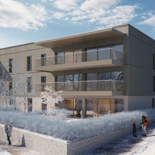 Modernes Mehrfamilienhaus im verschneiten Winterlandschaft | © Maria Gruber