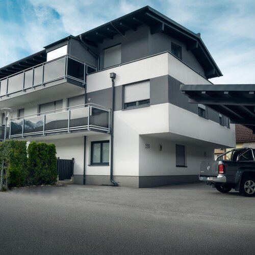 Building number 350 with balconies and carport