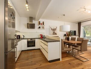 Open-plan kitchen with island and dining area