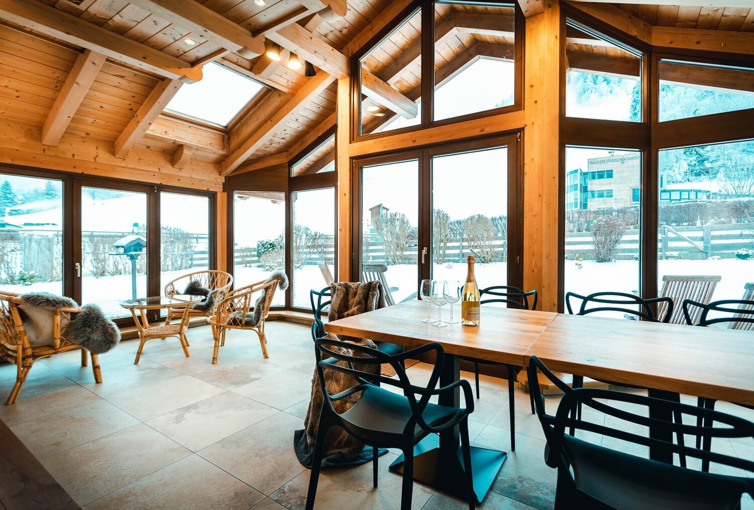 Wooden cabin dining area with expansive windows
