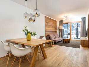 Open living and dining area with wooden furniture